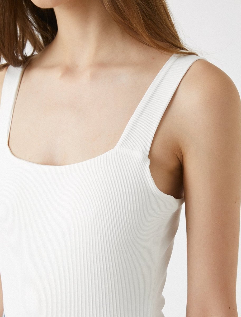 https://www.usolo.com/cdn/shop/products/square-neck-tank-bodysuit-in-white-koton-usolo-outfitters-998950_913x1200.jpg?v=1673376260